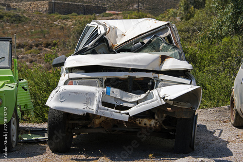 Wrecked and junk cars on the road 