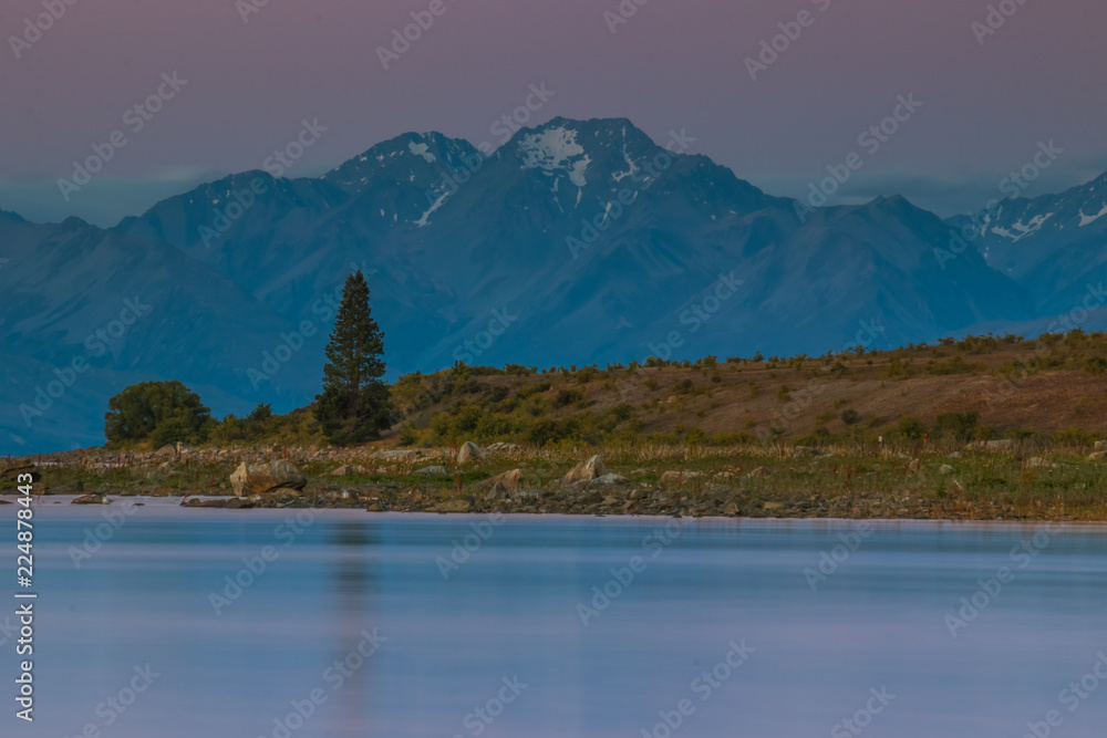 Calm lake with rocky shore