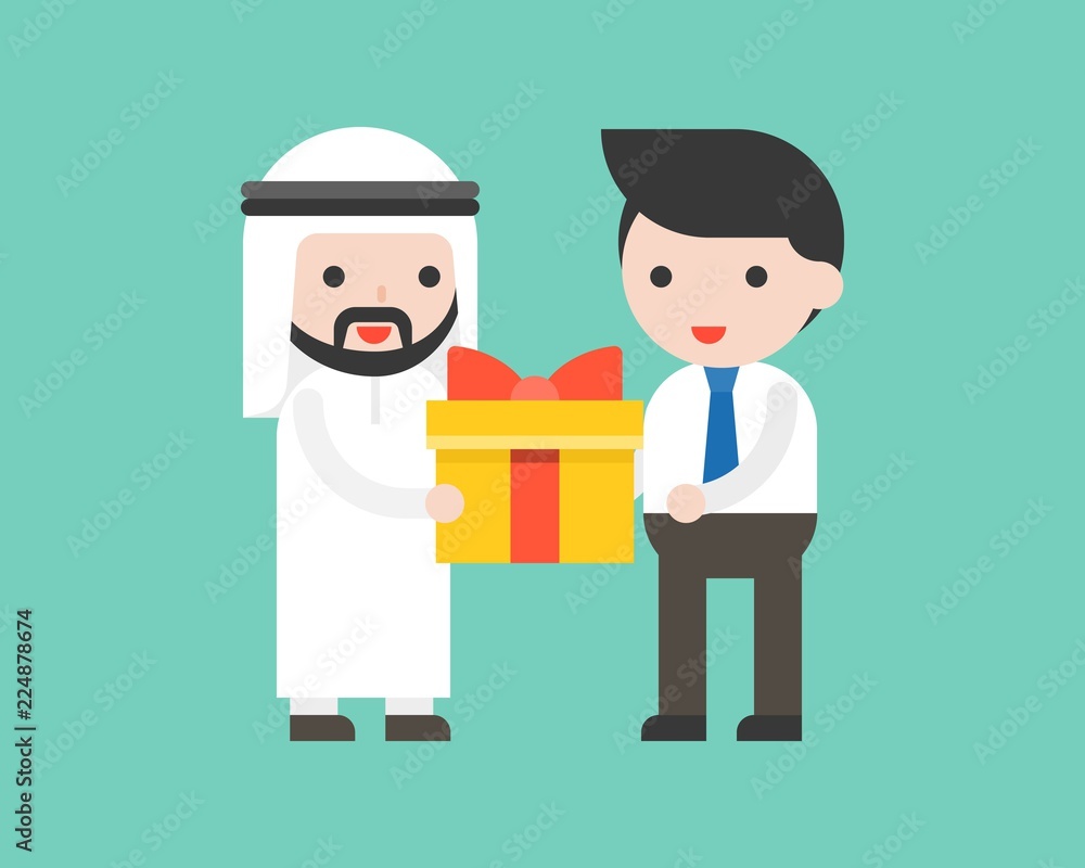 Arab businessman receiving a gift box from another businessman Arab businessman receiving a gift box from another businessman