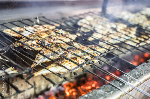 Small fish barbequed on charcoal