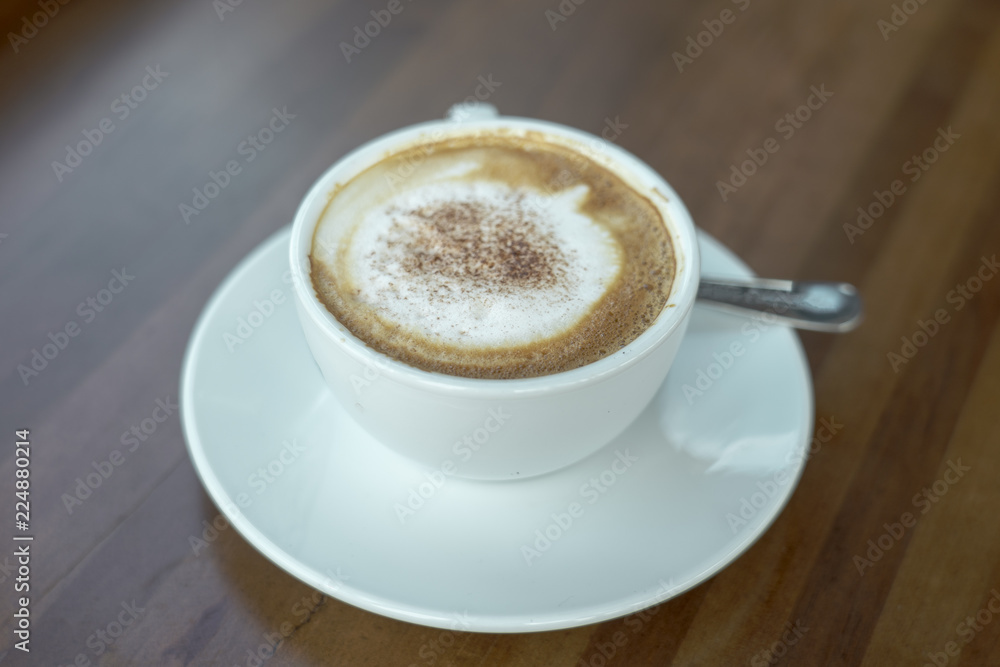 Cappuccino cup with lacquer art on wooden floor Beautiful Foam, Ceramic Cup, Modern Color, Place for Message Cappuccino cup with lacquer art on wooden floor Beautiful Foam, Ceramic Cup, Modern Color, Place for Message