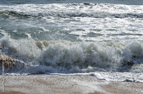 Ocean wave breaking on the beach surf