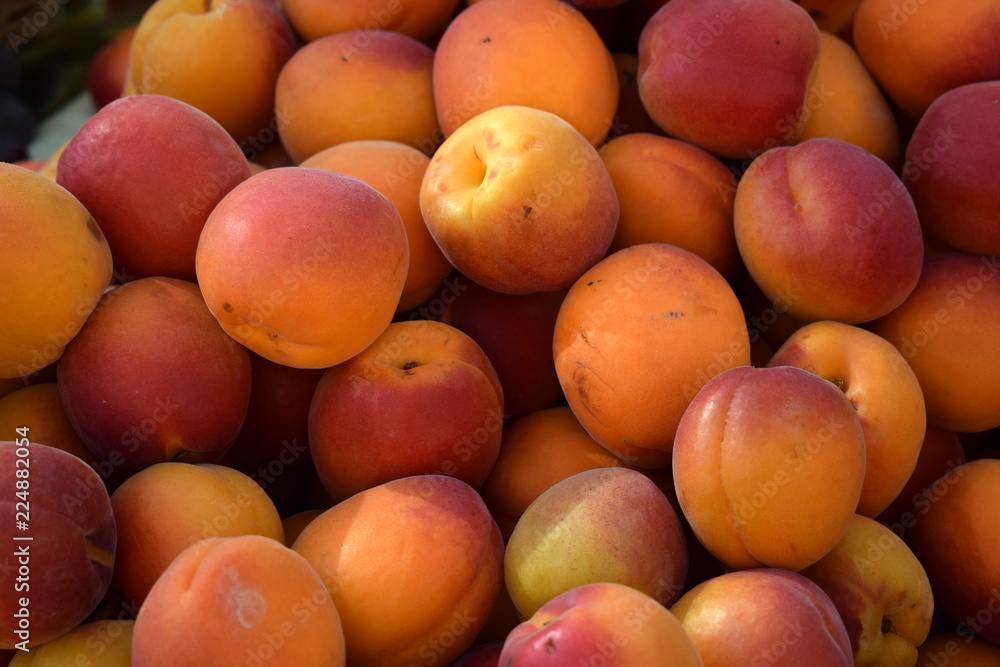 Fresh ripe red-orange apricots on the shelves of the market Fresh ripe red-orange apricots on the shelves of the market