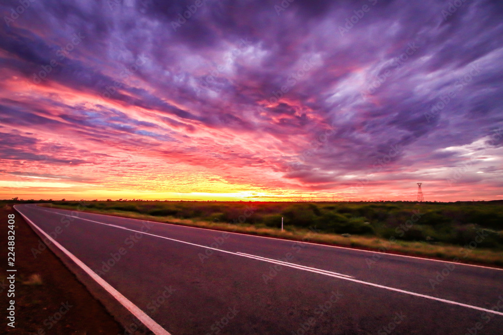 Dramatic sunset sky over outback road