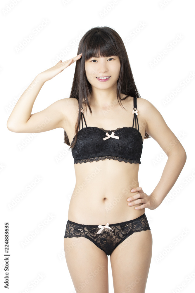 Fototapeta premium Chinese woman posing in panties and bra on white background