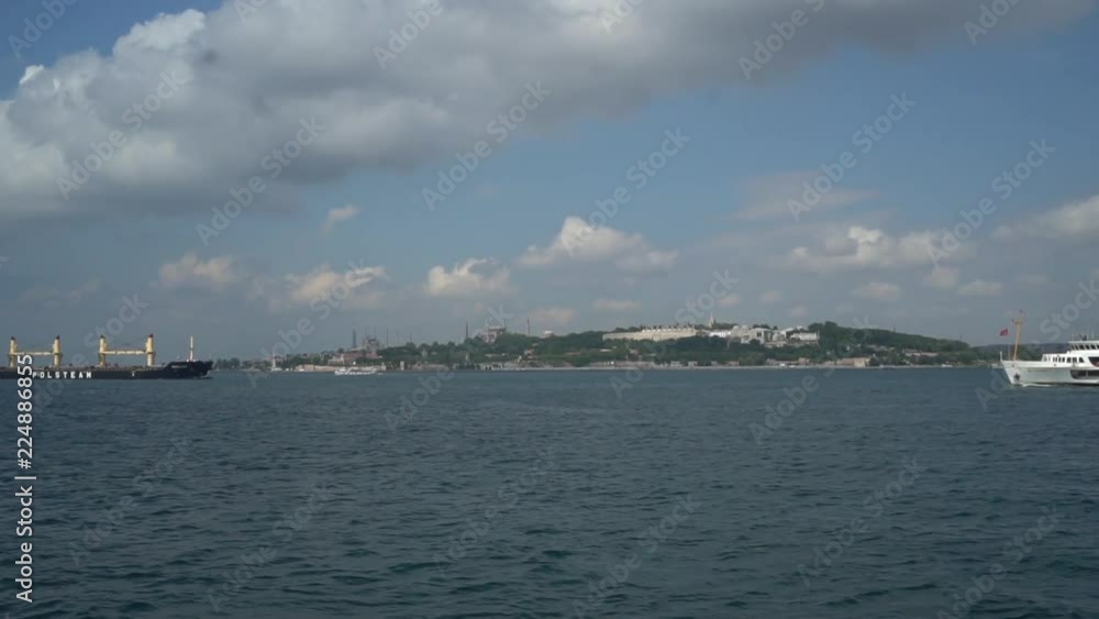 Istanbul Ferry boats work between the two continents; Asia & Europe. The channel looks like a giant blue river that saparates the city into two Istanbul Ferry boats work between the two continents; Asia & Europe. The channel looks like a giant blue river that saparates the city into two