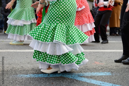 people in Spanish carnival costumes on the street