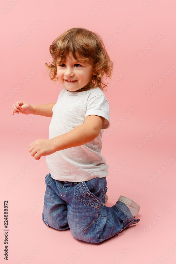Portrait of happy joyful beautiful little boy, studio shot on pink Portrait of happy joyful beautiful little boy, studio shot on pink