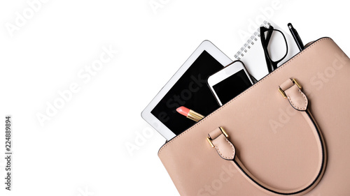 Business woman's everyday-life travel accessories flat lay on white background with formal beige handbag, a cellphone, blank notepad, luxury pen, glasses and lipstick, copy space and clipping path photo