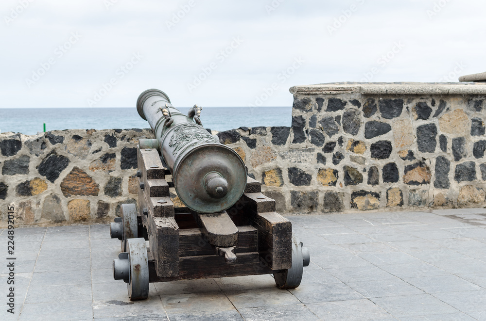 old historic cannon in front of the harbour wall old historic cannon in front of the harbour wall