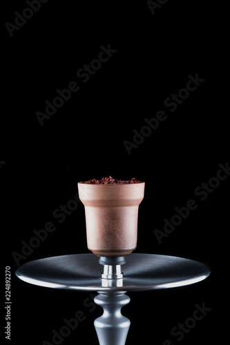 Modern hookah isolated on black background. Eastern smokable water pipe smoking on black background.