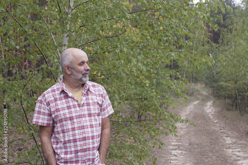 A man of mature age in the forest