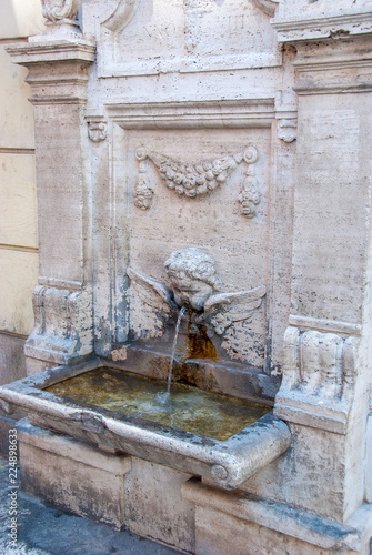Old stone drinking fountain in Rome