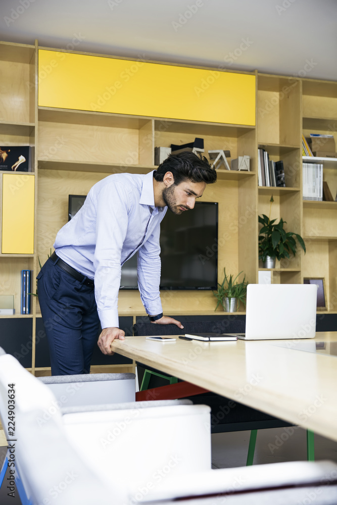 Young businessman in the modern office Young businessman in the modern office