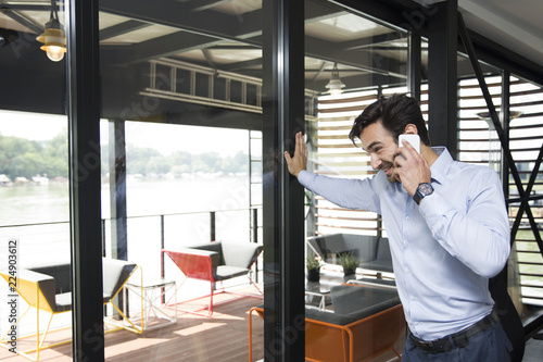 Young businessman using mob...
