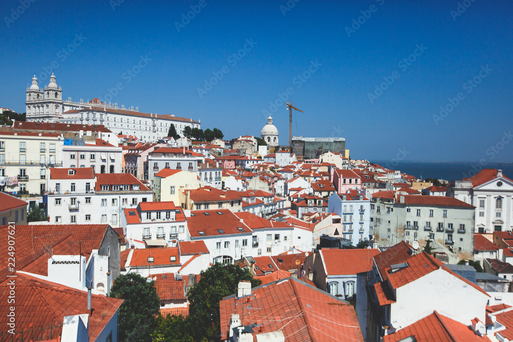 Beautiful super-wide angle aerial panoramic view of Lisbon, Portugal, with Alfama district and historical old town, seen from the observation deck belvedere