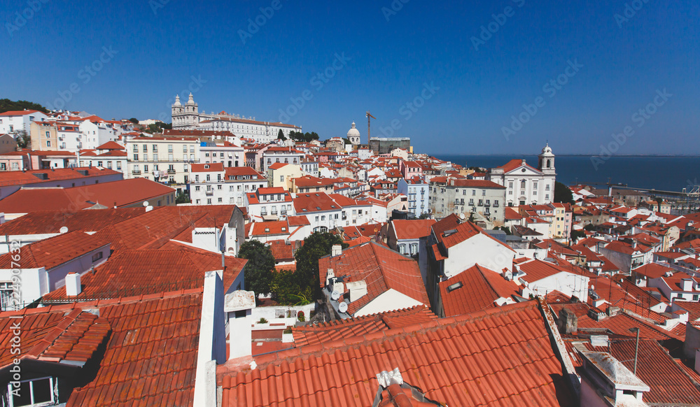 Beautiful super-wide angle aerial panoramic view of Lisbon, Portugal, with Alfama district and historical old town, seen from the observation deck belvedere