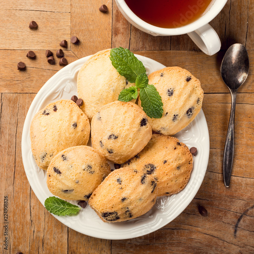 Flat lay with homemade cookies Madeleine with chocolate chips. Holidays and party food concept. Top view. photo