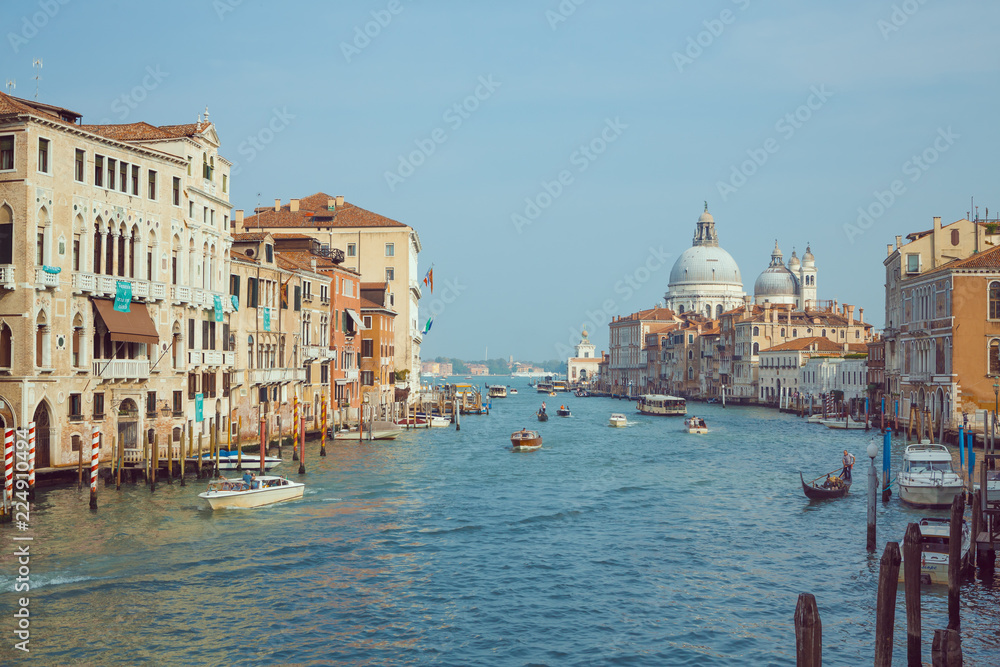 Basilica Santa Maria della Salute, Venice, Italy. Landscape Grand Canal with gondolas and boats.