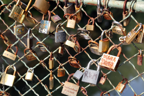 Lots of padlocks locked on a bridge. Locks bridge 