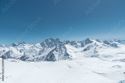 Winter snow covered mountain peaks in Caucasus. Great place for winter sports photo