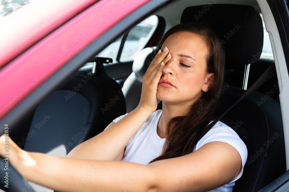Woman Yawning Inside Car