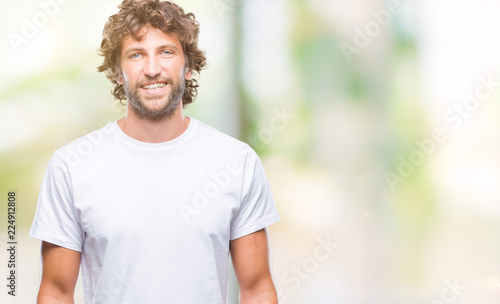Handsome hispanic model man over isolated background with a happy and cool smile on face. Lucky person.