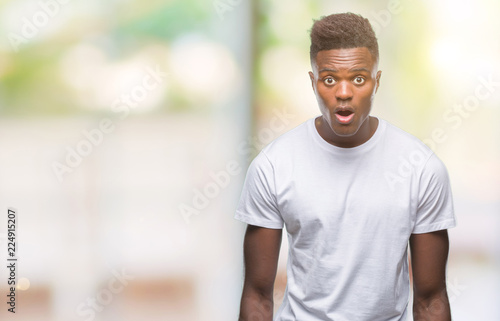 Young african american man over isolated background afraid and shocked with surprise expression, fear and excited face.
