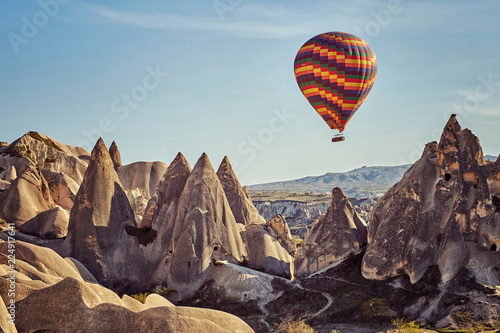 Beautiful rocky landscape with balloons in the mountains on a sunny summer day.