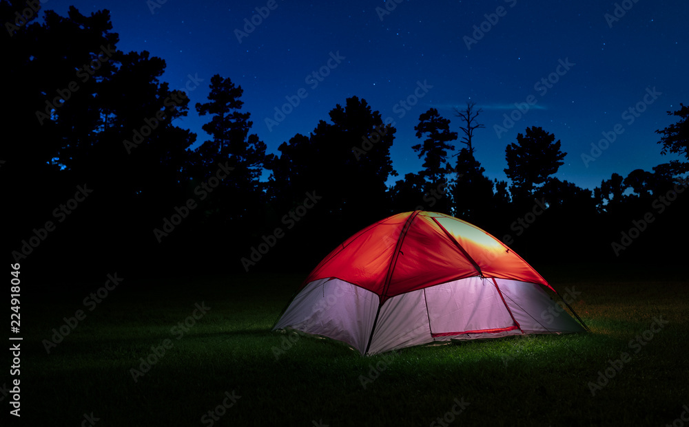 Stars above a lighted tent