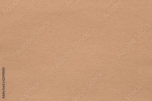 light brown paper texture background. colored cardboard fibers and grain. empty space concept. photo