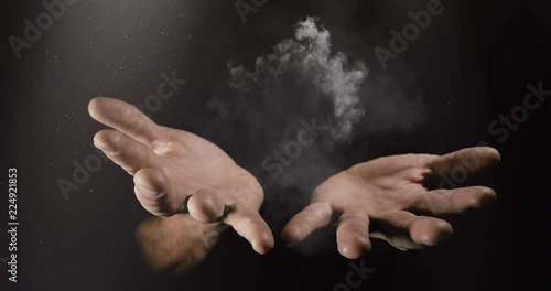 Modern magician conjuring smoke from his hands, Magic Trick Concept