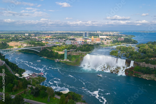 Niagara Falls. American falls.  Boat with tourists moves along Bride Veil Falls. photo