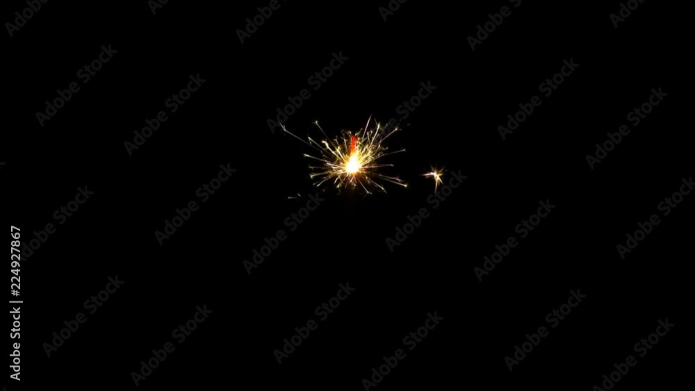 Sparkler burning on black background. Easily inserted into any picture, just choose SCREEN as your transition mode. Sparkler burning on black background. Easily inserted into any picture, just choose SCREEN as your transition mode.