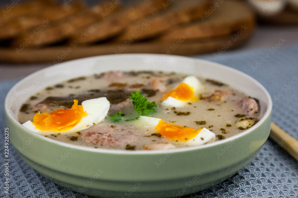 Żurek - polish easter soup with eggs and white sausage Żurek - polish easter soup with eggs and white sausage
