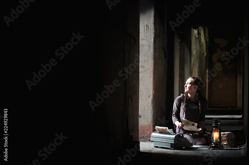 A girl with old books in the old house