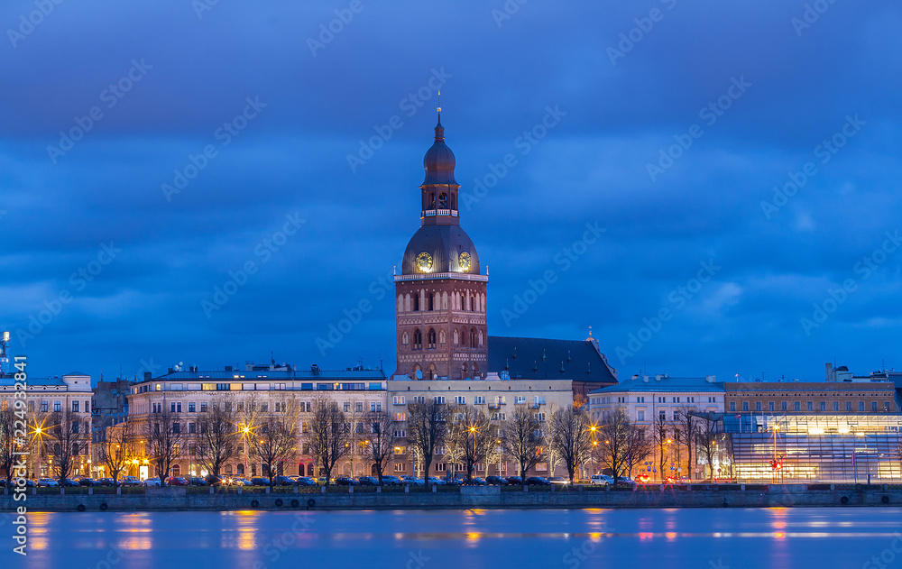Fototapeta premium Historical building of Riga Dome Cathedral and Daugava river at night , Latvia.