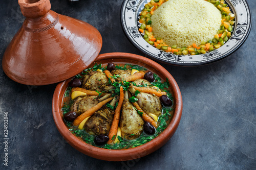 Moroccan tajine with chicken and carrots, copy space photo