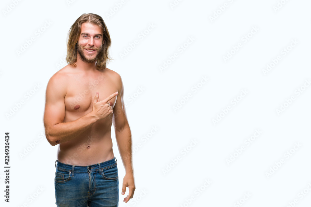 Young handsome shirtless man with long hair showing sexy body over isolated  background cheerful with a