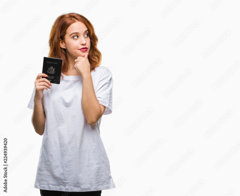 Young beautiful woman holding passport of united states of america over isolated background serious face thinking about question, very confused idea Young beautiful woman holding passport of united states of america over isolated background serious face thinking about question, very confused idea