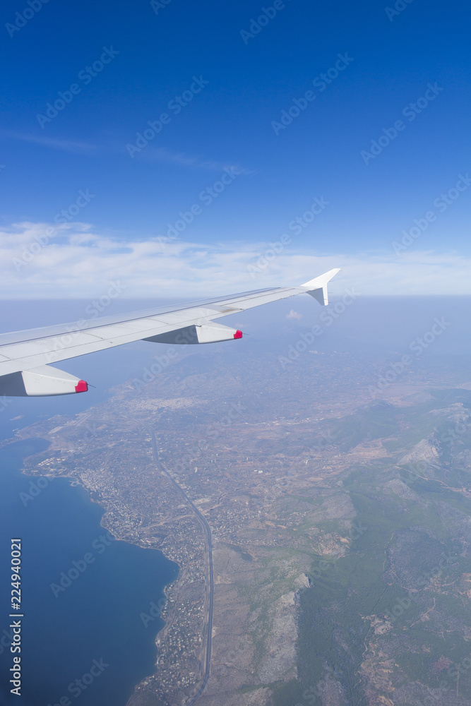 Fototapeta premium Ariel view from an airplane flying, wonderful landscape underneath