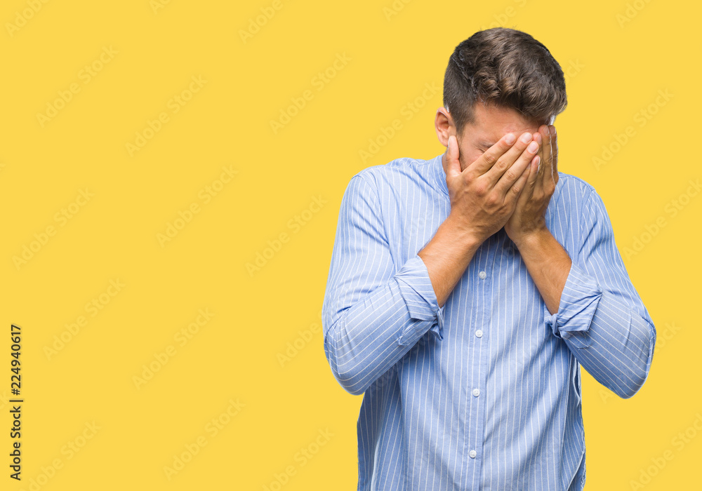 Young handsome man over isolated background with sad expression covering face with hands while crying. Depression concept. Young handsome man over isolated background with sad expression covering face with hands while crying. Depression concept.