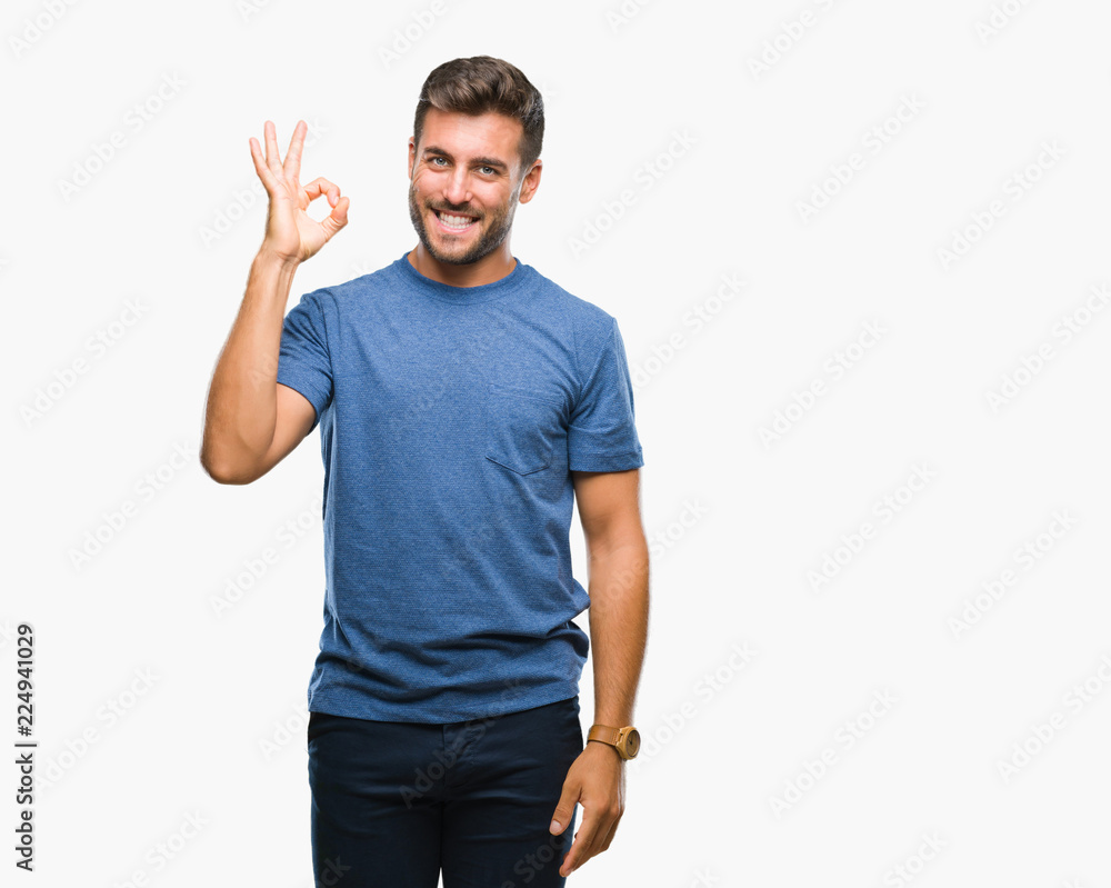 Young handsome man over isolated background smiling positive doing ok sign with hand and fingers. Successful expression. Young handsome man over isolated background smiling positive doing ok sign with hand and fingers. Successful expression.