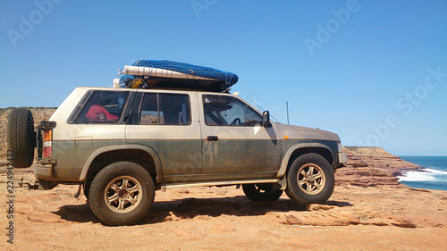 Off-road verhicle on a lonely costline beach © PHOTOWORLD