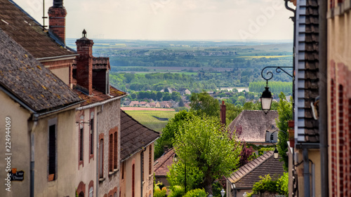 Brown roofs of village in Champagne region with marvellous view on vineyards and hills, France photo
