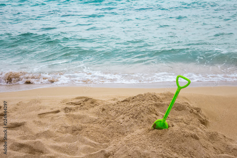 children scoop on the beach, end of vacation, autumn mood children scoop on the beach, end of vacation, autumn mood