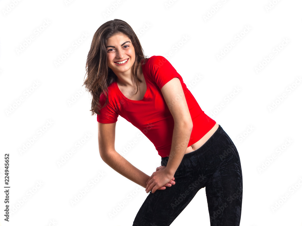 beautiful brunette teenager sport girl in red shirt is exercising, white background beautiful brunette teenager sport girl in red shirt is exercising, white background