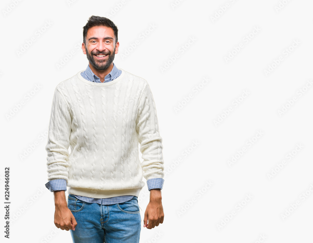 Adult hispanic man wearing winter sweater over isolated background with a happy and cool smile on face. Lucky person. Adult hispanic man wearing winter sweater over isolated background with a happy and cool smile on face. Lucky person.