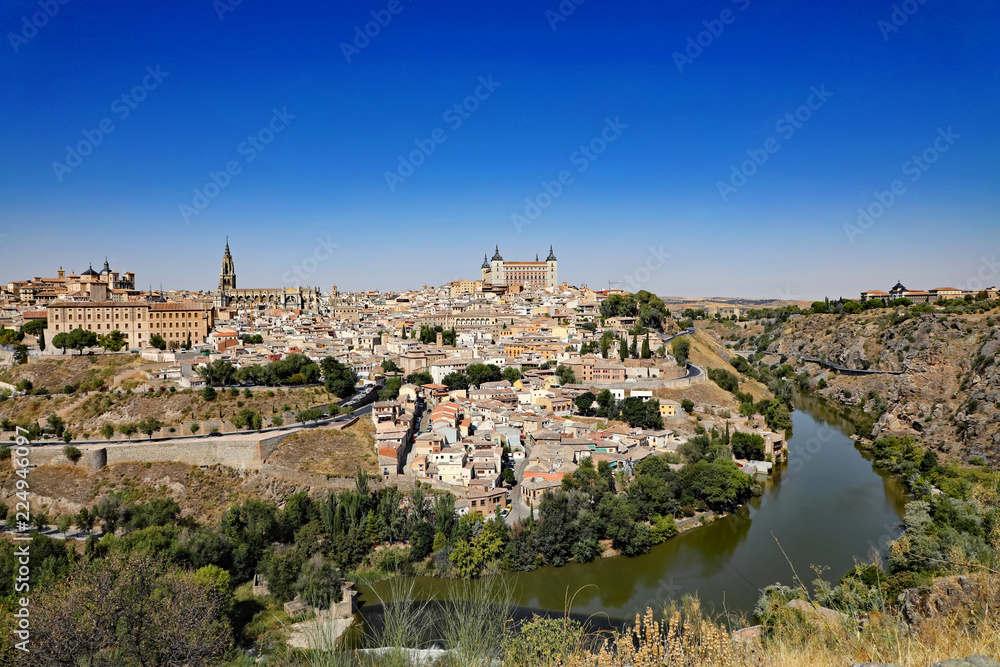 Aerial view of the ancient city of Toledo, Spain, with the Targus River.  The Alcazar and the Cathedral and churches are major tourist attractions.