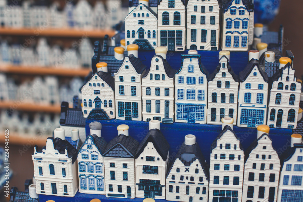 Traditional souvenirs from Amsterdam rows of Delftware porcelain Dutch style houses, Shop window, Netherlands